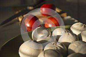 Ravioli with tomato on the background of wood