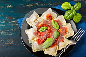 Ravioli with tomato sauce and basil