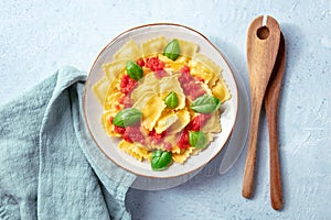 Ravioli with tomato sauce and basil. A plate of stuffed pasta, shot from above