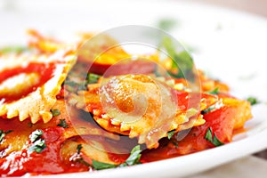 Ravioli with tomato sauce. Typical italian dish.