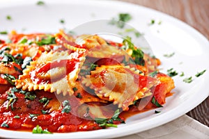 Ravioli with tomato sauce. Typical italian dish.
