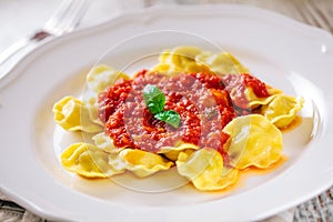 Ravioli with tomato sauce. Typical italian dish.