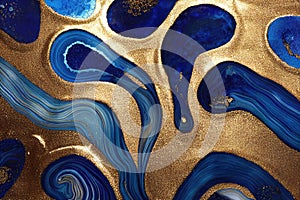 Ravishing blue and golden acrylic liquid ink swirl abstract background.