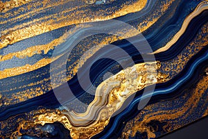 Ravishing blue and golden acrylic liquid ink swirl abstract background.