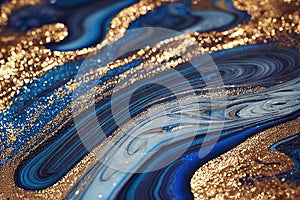 Ravishing blue and golden acrylic liquid ink swirl abstract background.