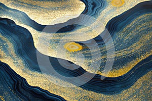 Ravishing blue and golden acrylic liquid ink swirl abstract background.