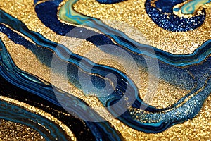 Ravishing blue and golden acrylic liquid ink swirl abstract background.