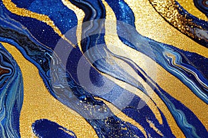 Ravishing blue and golden acrylic liquid ink swirl abstract background.