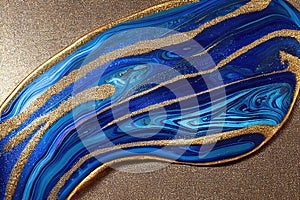 Ravishing blue and golden acrylic liquid ink swirl abstract background.