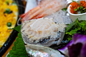 slices of raw abalone sashimi