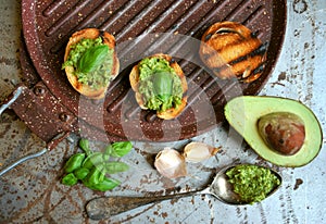 Raw ,alkaline food with avocado and basil pesto with garlic