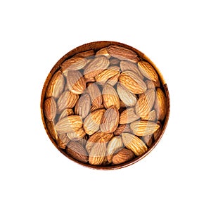 Raw almond nuts in the round wooden bowl isolated on white background.