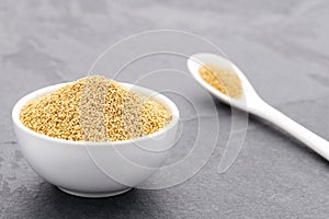 Raw amaranth seeds in a bowl and spoon - Amaranthus