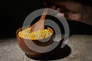 Raw Amorphous Pollen On A Wooden Spoon