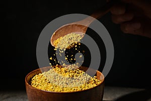 Raw Amorphous Pollen On A Wooden Spoon