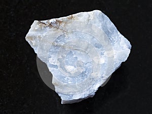 raw Angelite (Blue Anhydrite) stone on dark photo