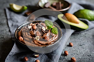 Raw avocado chocolate mousse with hazelnuts