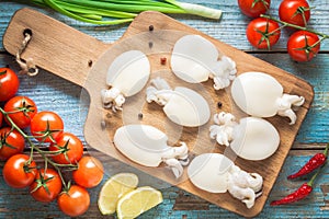 Raw babies cuttlefish on a cutting board