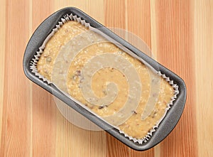 Raw banana loaf batter in a lined tin