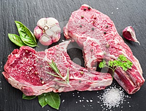 Raw beaf steaks with spices.