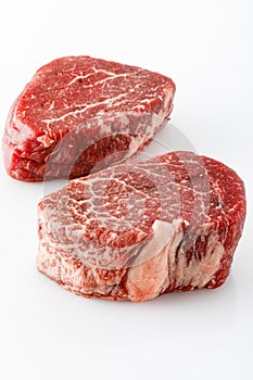 Raw beef filet mignon steak on white