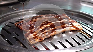 Raw beef and pork slice on grille for barbecue