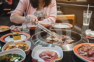 Raw beef and pork slice on grille for barbecue or Japanese style yakiniku