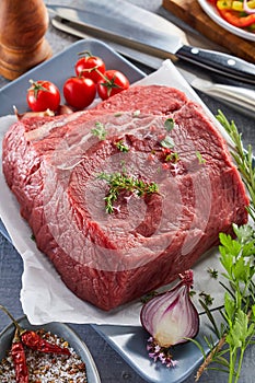 Raw beef rump steak with ingredients