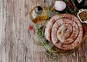 Raw beef sausages on a cast-iron pan, selective focus