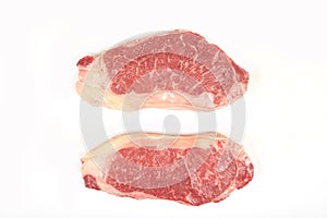 Raw beef sirloin steak isolated on white background