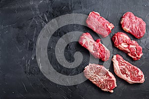 Raw beef steak cuts with top blade, chuck roll and rump steak, top view, space for text