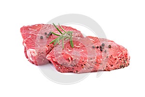 Raw beef steak with green herbs
