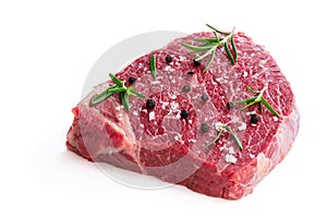 Raw beef steak with herbs and spices isolated on white