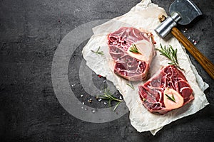 Raw beef steak osso bucco on black. Marble meat.