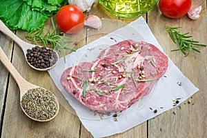 Raw beef steak with seasoning