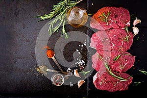 Raw beef steaks with spices and rosemary