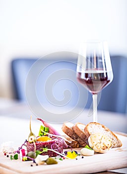 Raw beef .Tasty Steak tartare. Classic steak tartare on wooden board. Ingredients: Raw beef meat salt pepper egg garlic chili