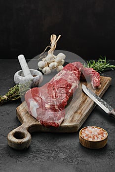 Raw beef tri-tip loin on cutting board
