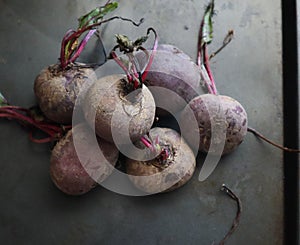 Raw beetroot on a black background