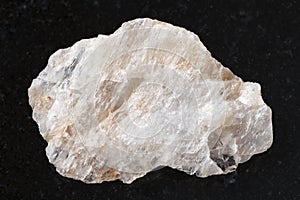 raw belomorite stone on dark background photo