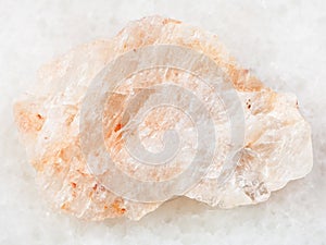 raw belomorite stone on white marble photo