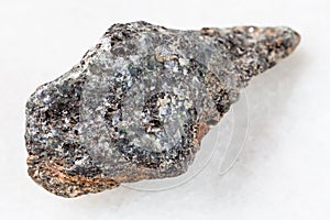 raw biotite nepheline syenite stone on white photo