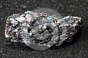 Raw Biotite rock with Kyanite crystals on black