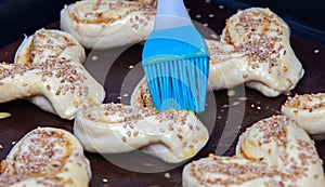 Raw biscuits on a baking sheet, ready to cook