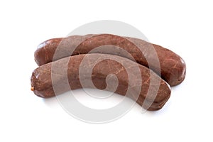 Raw black pudding on white background