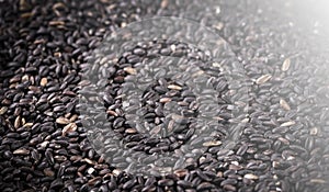 raw black rice as background.. Selective focus