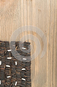 Raw Black Wild Rice on Wood Background