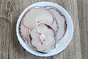 Raw blue shark meat on white plate