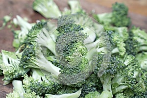 Raw broccoli on wooden background. Healhty food with good vitamin and nutrition.