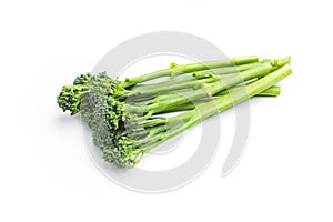 Raw broccolini heap isolated on white background